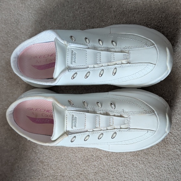Skechers Shoes - Skechers White Slip-On Sneakers with Pink Insole Accents